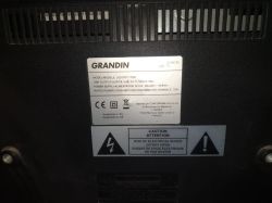 Nameplate and warning label on the back of a Grandin LD39GC25 TV.
