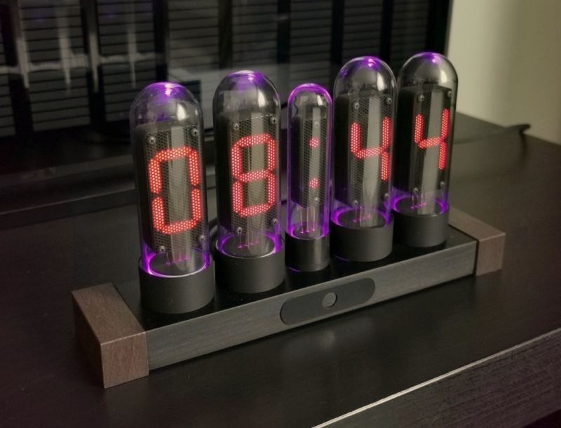 LED clock with glass bulb-like covers and purple backlighting