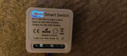 Smart Switch with technical label and illuminated LED.