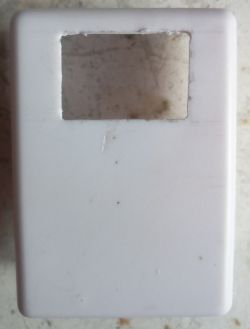 White enclosure with rectangular cutout for seven-segment display