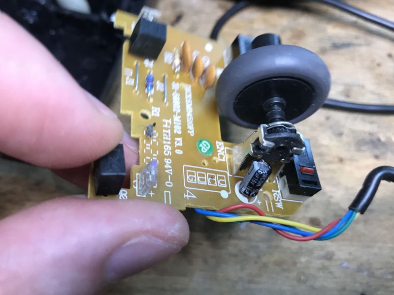 Inside View of a Computer Mouse with an Encoder Interior of an old computer mouse with visible components