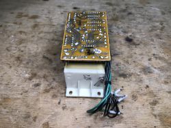 Electronic module with a PCB and wire bundle on a wooden workbench