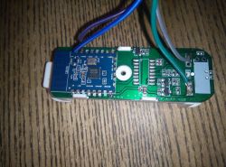 Close-up of a circuit board with attached wires.