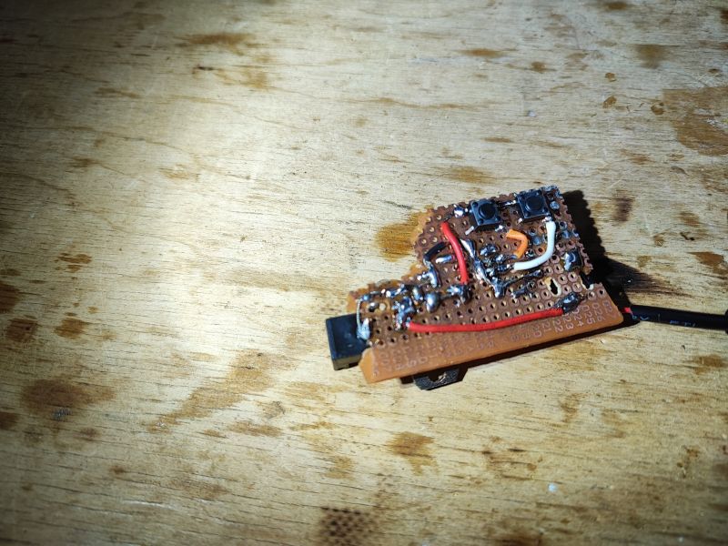 Prototype LED Dimmer on a Perforated Board Prototype LED dimmer on a perforated board with two buttons and soldered wires.