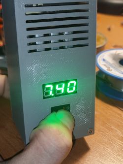 Close-up of a device housing with a display showing the value 3.48.
