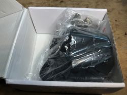 WiFi Valve Controller Kit Contents WiFi valve controller kit, packaged in transparent plastic and a cardboard box.