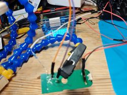 Compact BL602 device connected to an external 3.3V power supply on a desk.