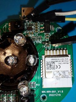 Close-up of a circuit board with various electronic components and a wireless module.