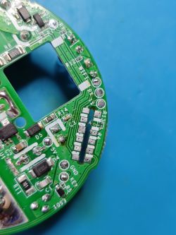 Close-up of Sonoff S60TPG PCB with pin labels Fragment of a round PCB from Sonoff S60TPG plug, with labeled pins and electronic components visible.
