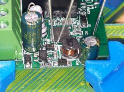 Close-up of a Mini Smart Switch circuit board with visible electronic components.