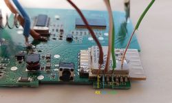 Close-up of a circuit board with wires connected to a WiFi module.