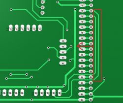 Close-up of a green PCB with marked traces and solder points.