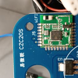 Close-up of an electronic circuit on a blue PCB labeled CZC20S.
