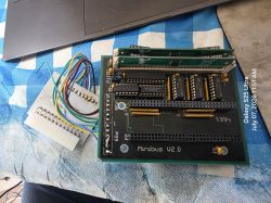 “Minibus V2.0” PCB with IC chips, connectors, and a bundle of colored wires on a table