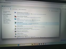 Okno „System i zabezpieczenia” w Panelu sterowania Windows z listą opcji, m.in. Zapora i Opcje zasilania.