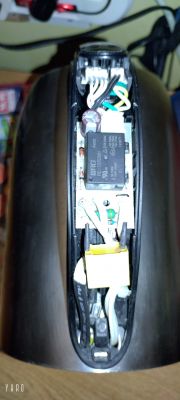Close-up of the interior of a damaged Hoffek AK3502 electric kettle showing electronic components.