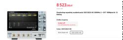Oscyloskop Siglent SDS1202X HD z wyświetlaczem i przyciskami sterującymi.