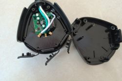 Interior of Feit Electric Smart Plug Image of the open interior of a Feit Electric outdoor smart plug showing wires and a circuit board.