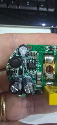 Close-up of damaged PCB with capacitors and electronic components