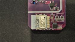 Radio module on a purple PCB with visible traces and SMD components