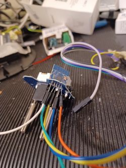 Close-up of a circuit board with attached colored wires.