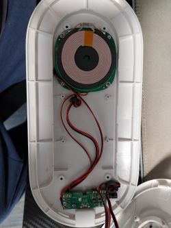 Inside of a Wireless Charger Inside of a wireless charger with visible induction coil and electronics.