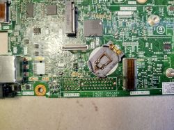 Close-up of a motherboard with electronic components and a battery holder.