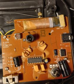 Close-up of a circuit board with electronic components like diodes and capacitors.