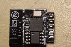 Close-up of a printed circuit board with an RTL8710BX chip.