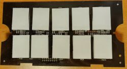 Touch panel with ten square buttons on a PCB.