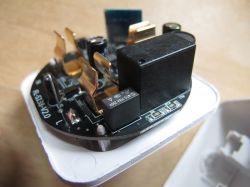 Interior of Smart Plug with Electronic Components Interior of a smart plug with electronic components on a circuit board.