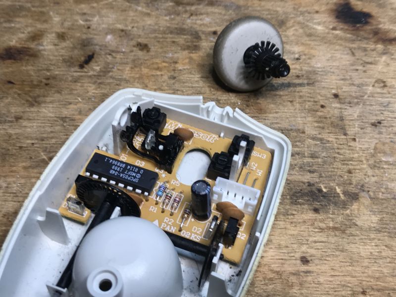 Inside View of an Old Trekker Ball Mouse Inside view of an old ball computer mouse with electronic components