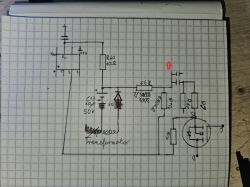 Niekompletny schemat elektroniczny na kartce w kratkę.