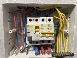 Electrical distribution box with IEK circuit breakers and wiring