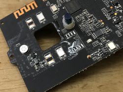 Close-up of a PCB with SMD components and solder flux residue