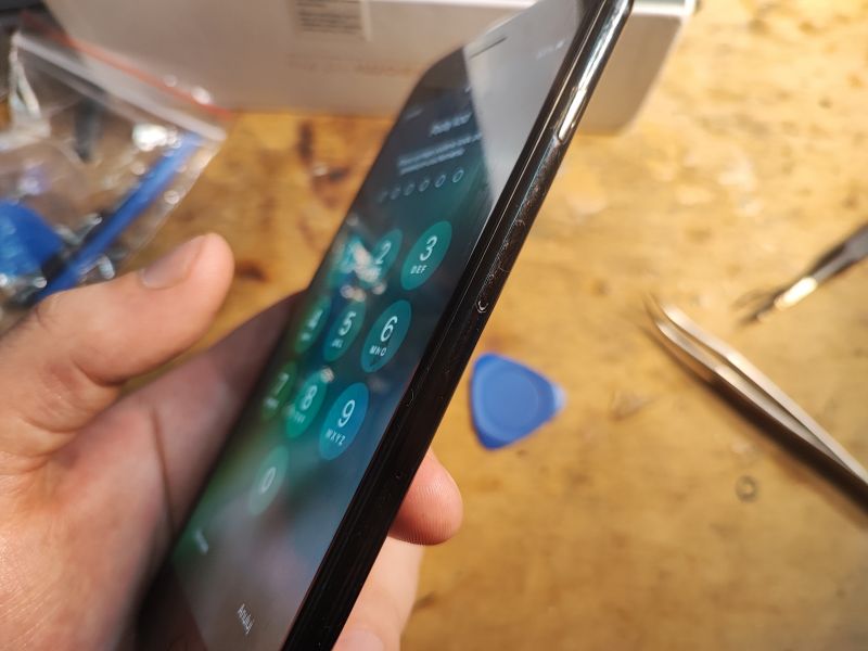 iPhone Repair with Exposed Screen iPhone under repair with exposed screen