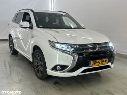 White Mitsubishi Outlander PHEV in a garage.