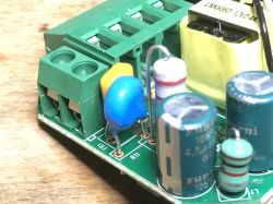 View of a wall-mounted thermostat kit with LED display, external sensor, and English manual.