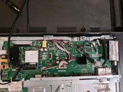 Main board of Sharp LC-43CFG6452E TV with visible connections and components.