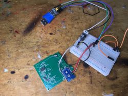 Programming and Flashing AVATTO TS02-EU-W3 Workbench with a circuit board connected to a breadboard with wires