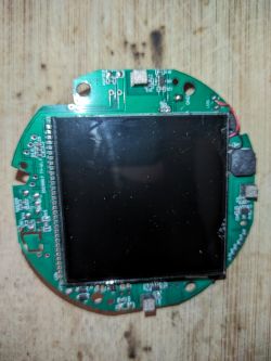 Green circuit board with a mounted LCD screen.