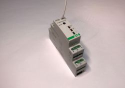 DIN rail relay module with a connected wire on top.