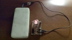 USB-Powered Nixie Tube Tester Nixie tube tester connected to a power bank via USB.