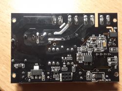 Back of a PCB with Electronic Components Photo of the back of an electronic circuit board with various components.