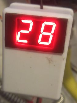 Homemade thermometer with red LED display showing 28°C