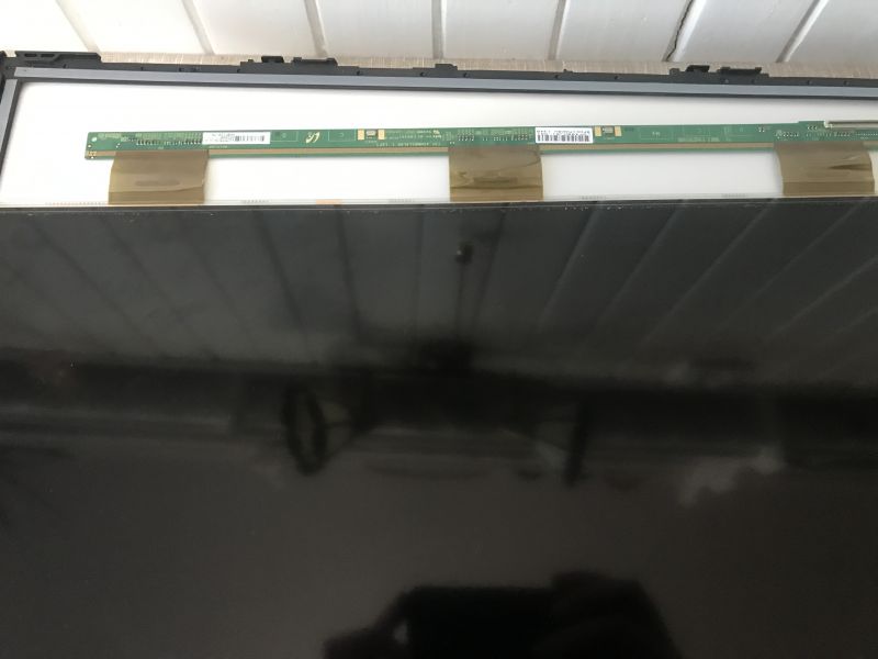 Disassembly of TV Screen TV with open casing, partially disassembled screen.