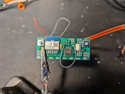 A circuit board with a CB2S communication module, visible with several connected wires.