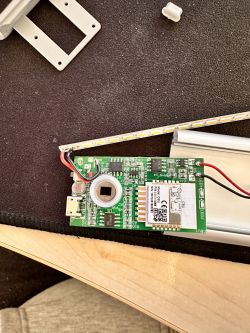 Close-up of a circuit board with a micro USB connector and LEDs on a strip.