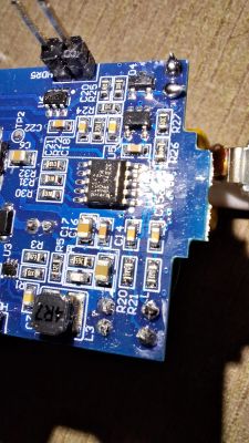 PCB with Electronic Components Close-up of a PCB with various electronic components.