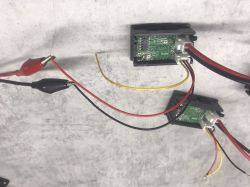 View of meter modules with connected power wires, showing incorrect current reading of 52A.